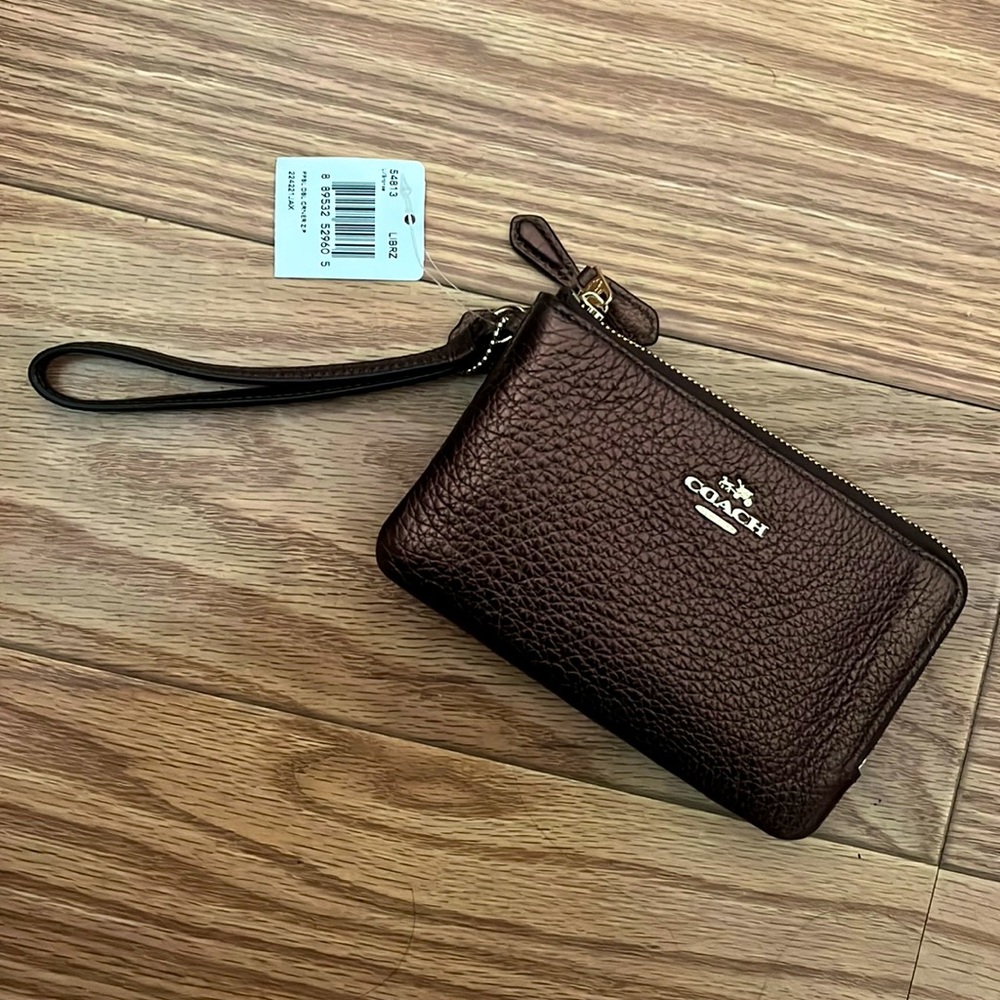 Brown metallic Coach wristlet